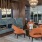 resident common space with modern stone fireplace and seating at 1333 South Ocean apartments in Pompano Beach