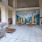 outdoor courtyard seating with fireplace and TV at 1333 South Ocean apartments in Pompano Beach