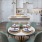 modern dining room with designer cabinetry and a kitchen island at 1333 South Ocean apartments in Pompano Beach